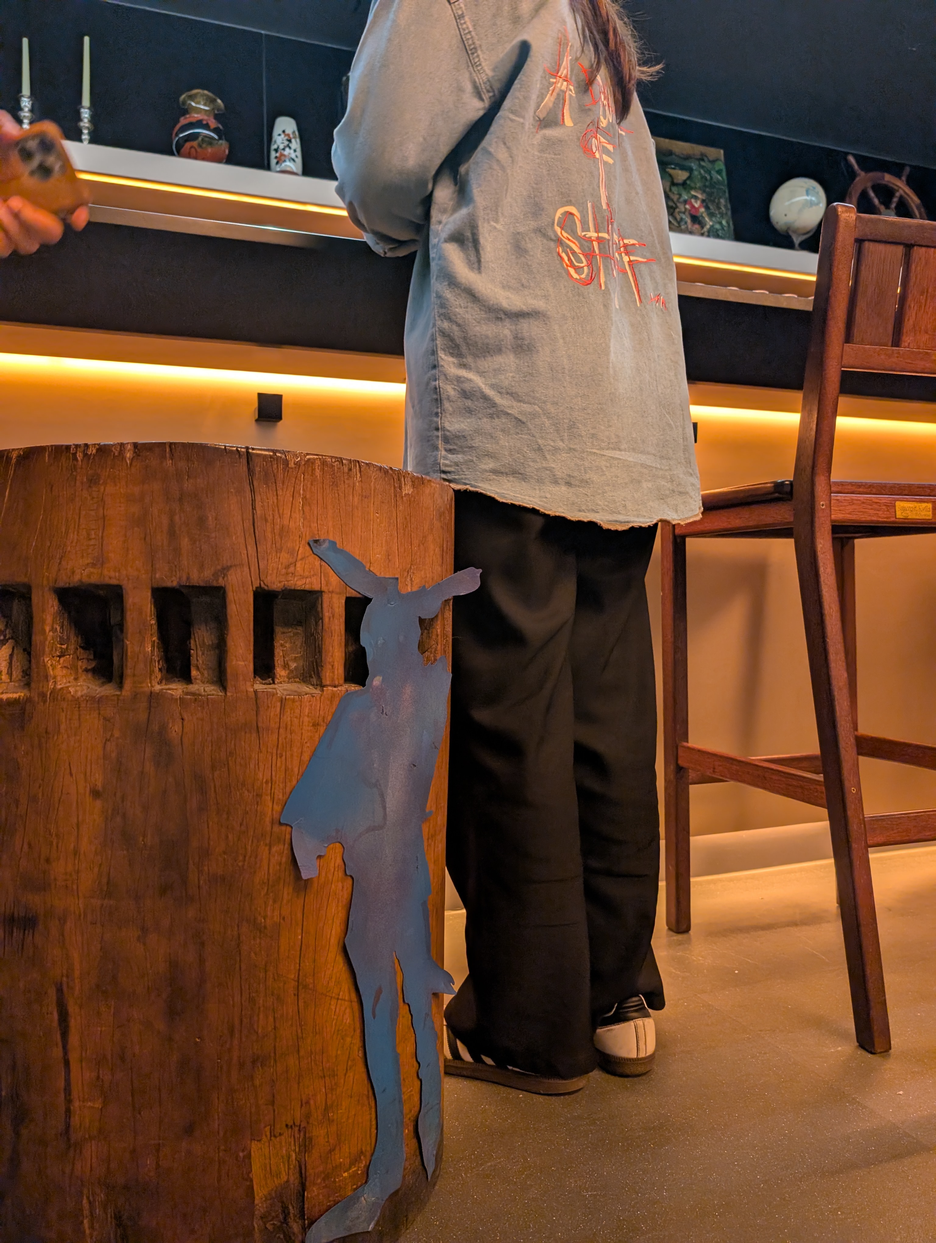 Bunnyman silhouette art piece at A Bunch Of Coffee bar counter